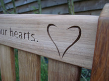 Load image into Gallery viewer, heart carved into wood on memorial bench