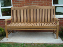 Load image into Gallery viewer, Smiley face logo carved into wood on a memorial bench - 4mb0965