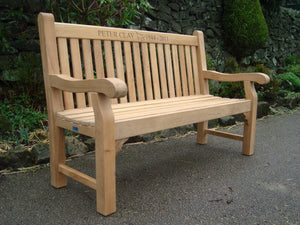 Wheelbarrow symbol carved into wood on a memorial bench - 4mb1508