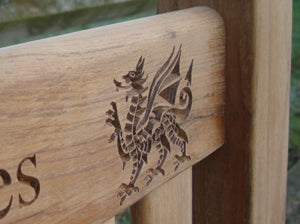 Welsh dragon carved into wood on memorial bench - 4mb1586