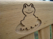 Load image into Gallery viewer, Flog carved into wood on a memorial bench - 4mb1593