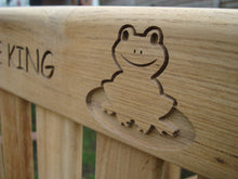 Load image into Gallery viewer, Flog carved into wood on a memorial bench - 4mb1593