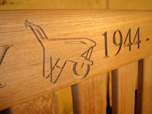 Load image into Gallery viewer, Wheelbarrow symbol carved into wood on a memorial bench - 4mb1508