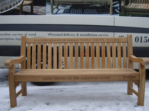 Shark symbol carved into wood on a memorial bench - 4mb1530
