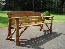 Load image into Gallery viewer, Heart symbol carved into wood on a memorial bench - 4mb2330