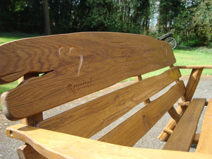 Heart symbol carved into wood on a memorial bench - 4mb2330