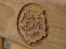 Load image into Gallery viewer, Yorkshire rose carved into wood on a memorial bench - 4mb2511