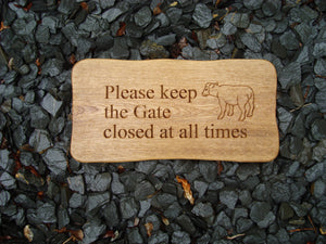 sign with a sheep carved into the wood - 4mb3012