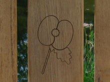 Load image into Gallery viewer, British Legion poppy carved into the wood on a memorial bench - 4mb3099