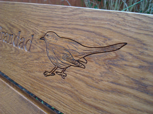 memorial bench with Blackbird carved into wood