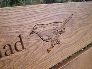 memorial bench with Blackbird carved into wood