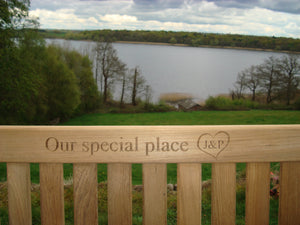 memorial bench with heart symbol carved into the wood - 4mb3654