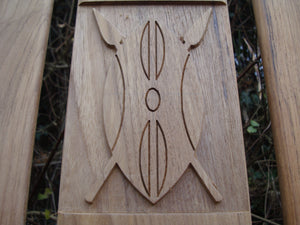 Kenya emblem carved into wood on memorial bench - 4mb2094