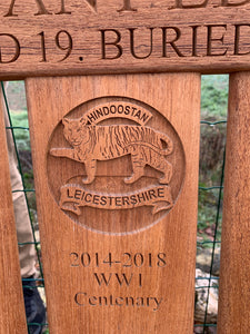 Leicestershire regiment insignia carved onto memorial bench