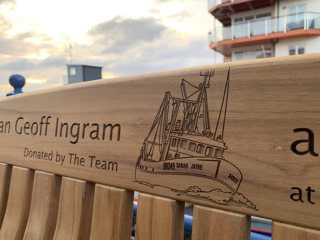 Trawler image carved on memorial bench