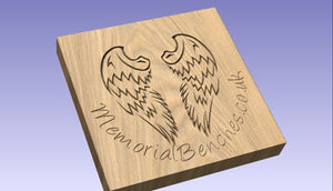Angel wings carved on a memorial bench