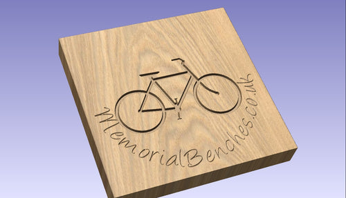 Bicycle carved on a memorial bench