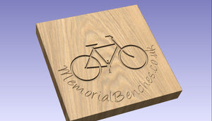 Bicycle carved on a memorial bench