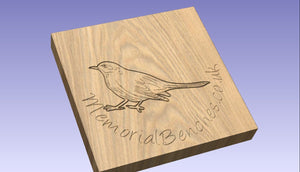 Blackbird engraved on a memorial bench