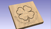 Load image into Gallery viewer, 4 leaf clover carved into wood on a memorial bench