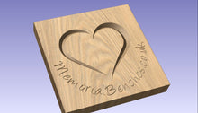Load image into Gallery viewer, Heart carved into wood on a memorial bench