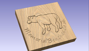 Sheep carved into wood on a sign