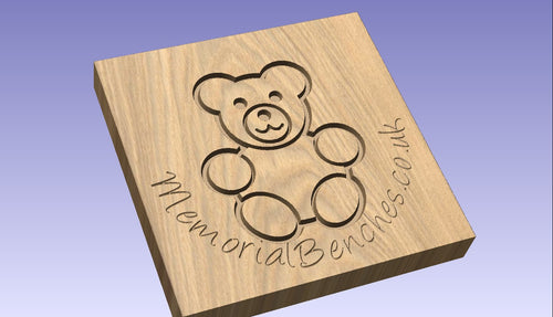 Teddy bear on a memorial bench