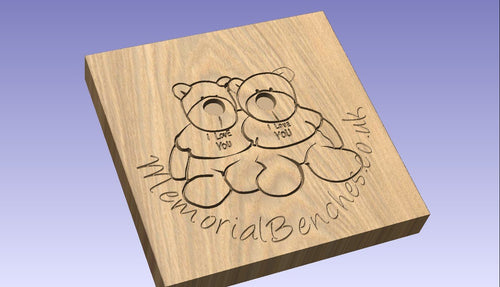 Teddy bear engraved on a memorial bench